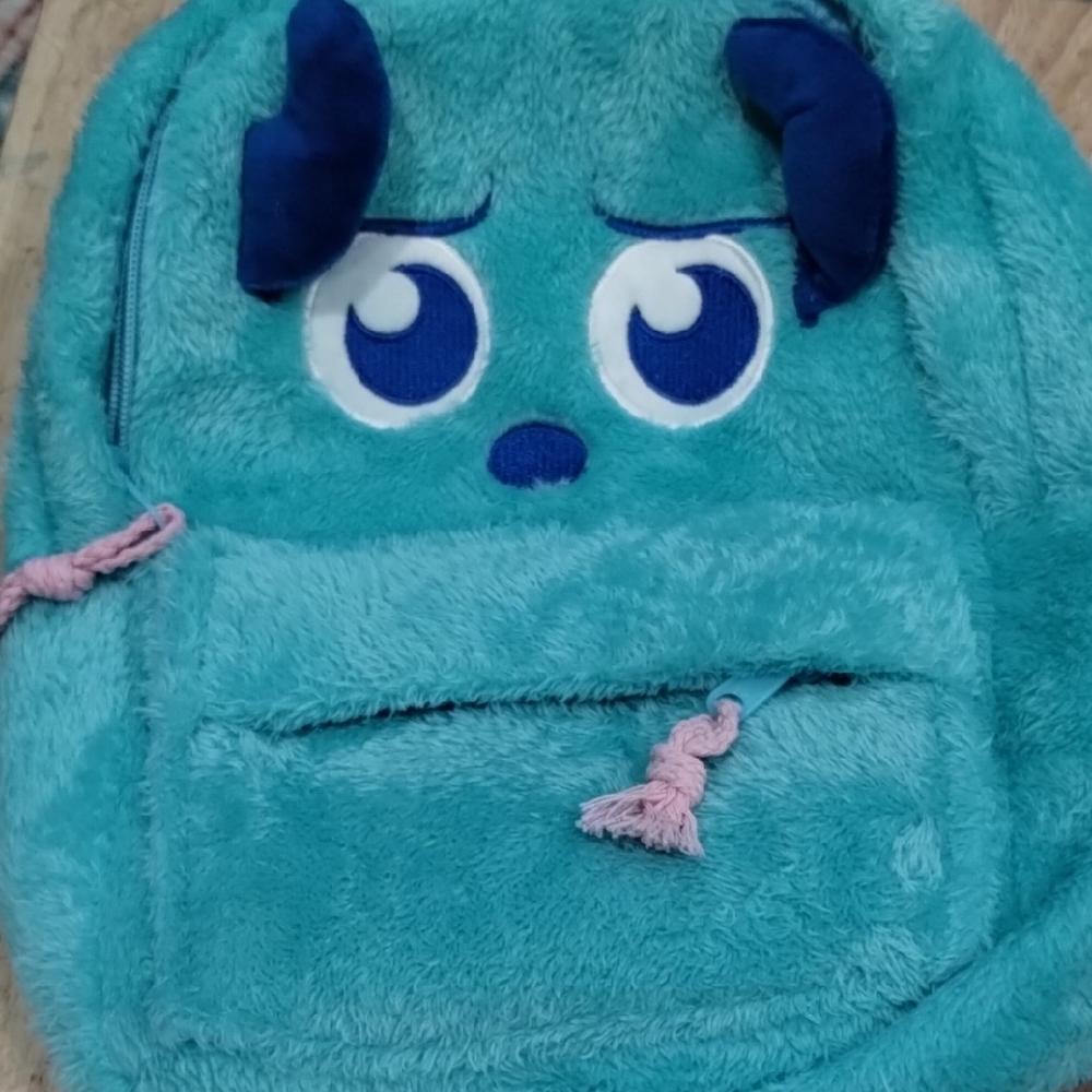 Teal Plush Backpack with Blue Accents